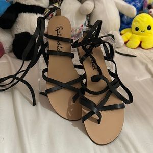 Original tan Splendid sandal with black wraparound tie strap.